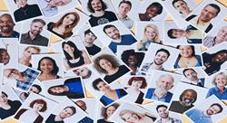 a collection of portraits of different people scattered around a table