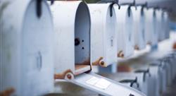 mailbox open in row of white mailboxes